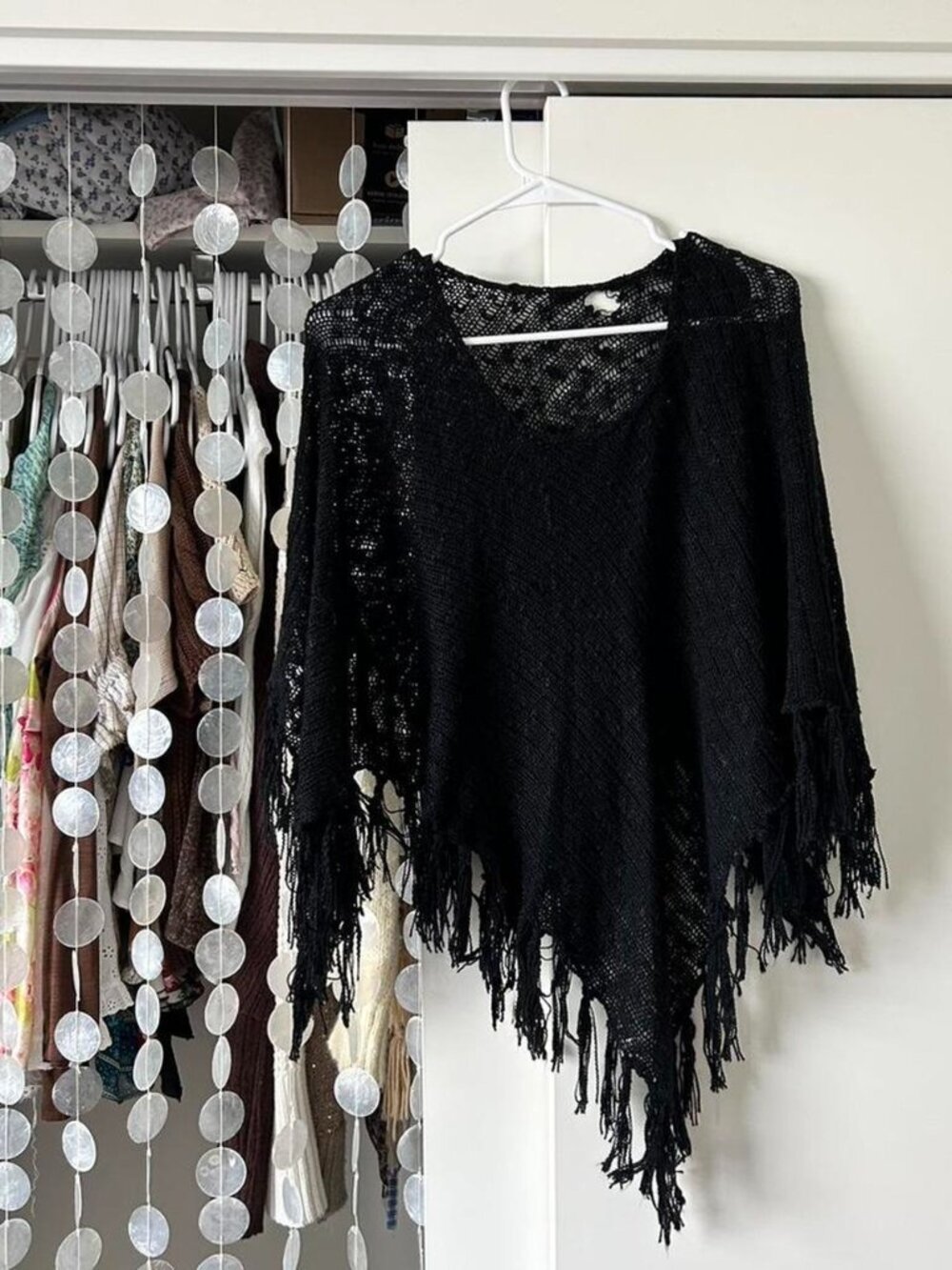 Black crochet poncho with fringe